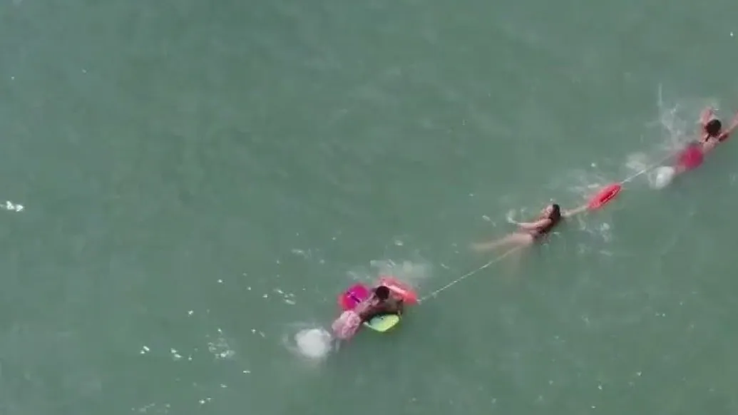 Drone Captures Lifeguards' Heroic Human Chain to Rescue Boogie Boarder in Florida