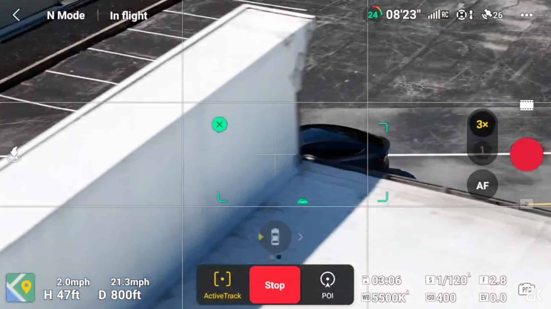 DJI Air 3 tracking a Tesla Model Y behind a building