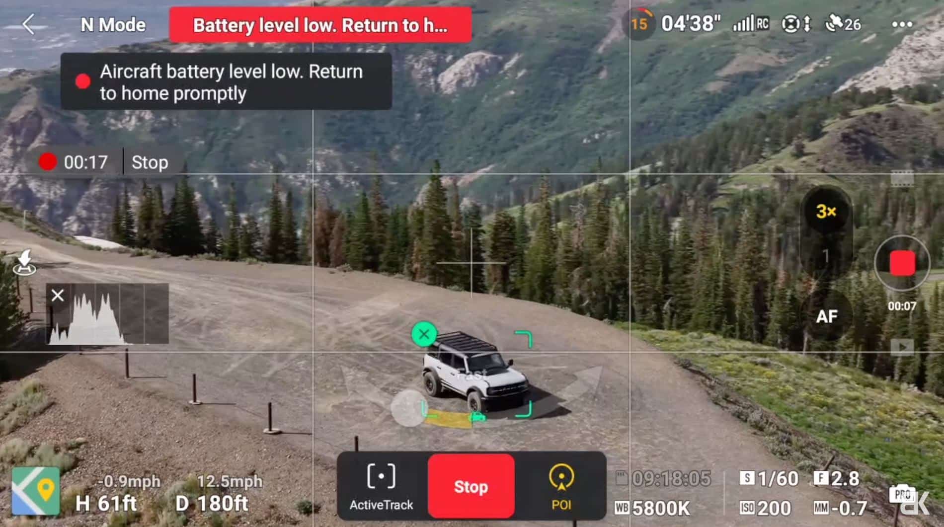 DJI Air 3 tracking a vehicle off-road during a Point of Interest orbit.