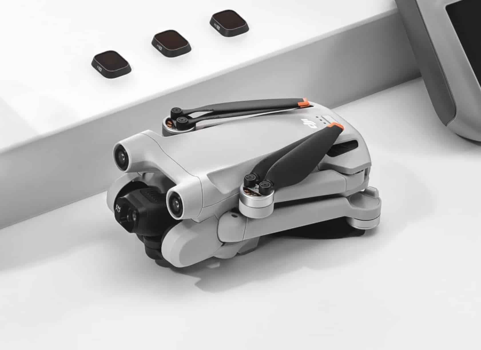 DJI Mini 3 Pro showing the older obstacle sensors and legs without stabilizing feet.