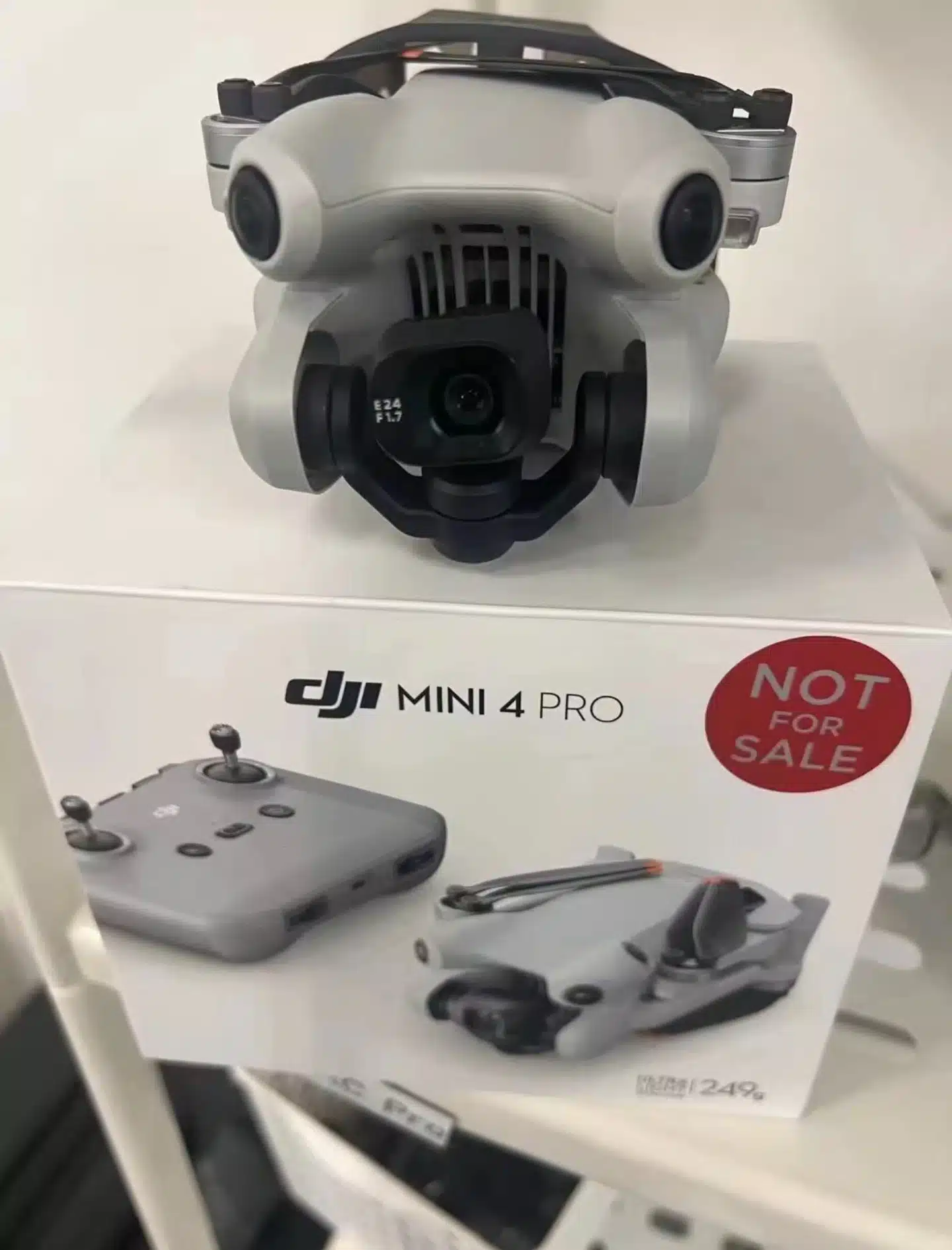 Leaked retail display of a DJI Mini 4 Pro above its box marked not for sale.