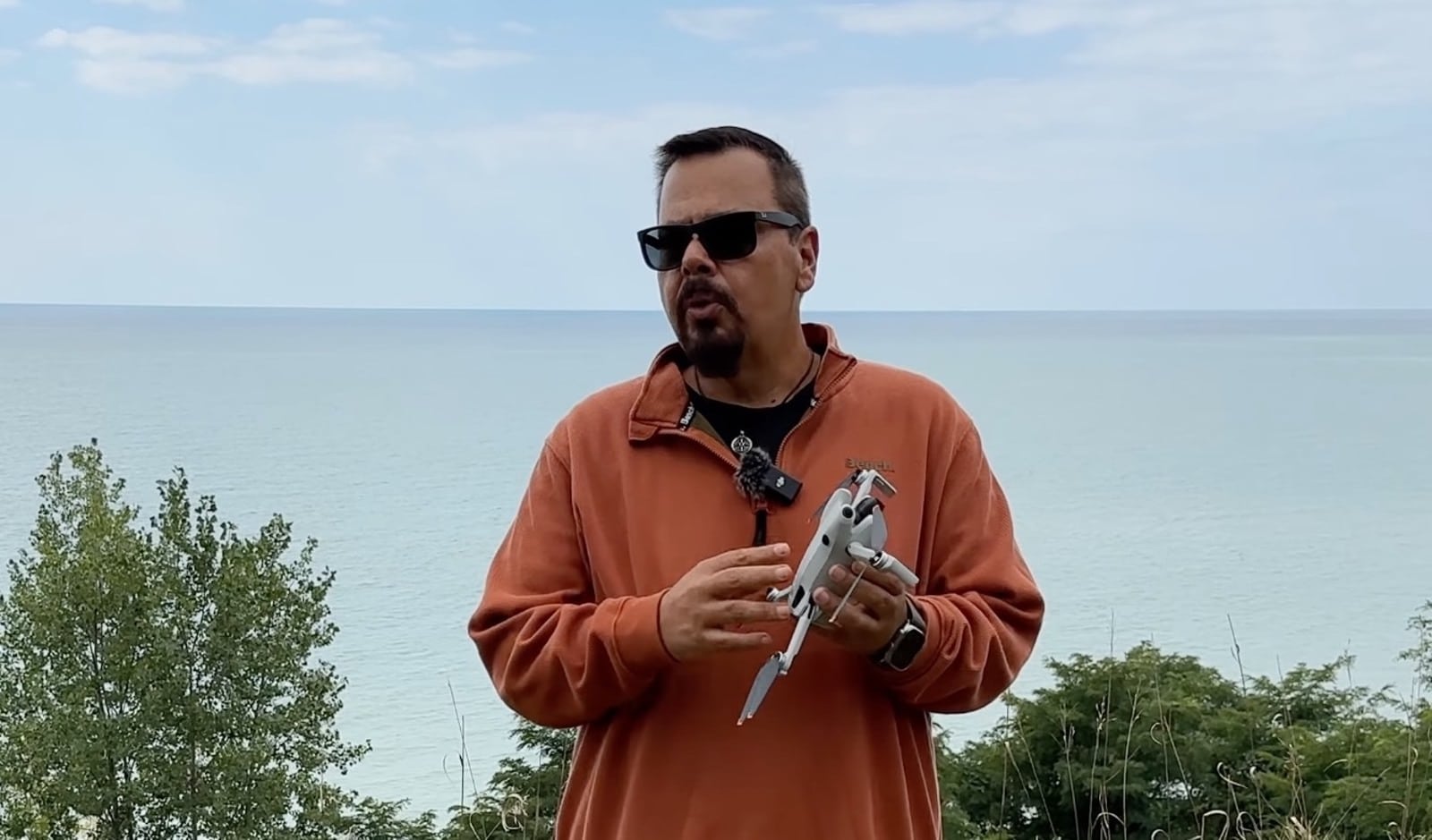 Shawn from Air Photography holding the new DJI Mini 4 Pro mini-drone.