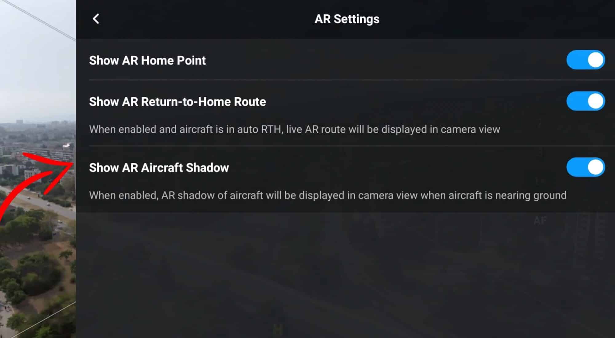 DJI Fly app with Vision Assist active while orbiting a building using the zoom camera.