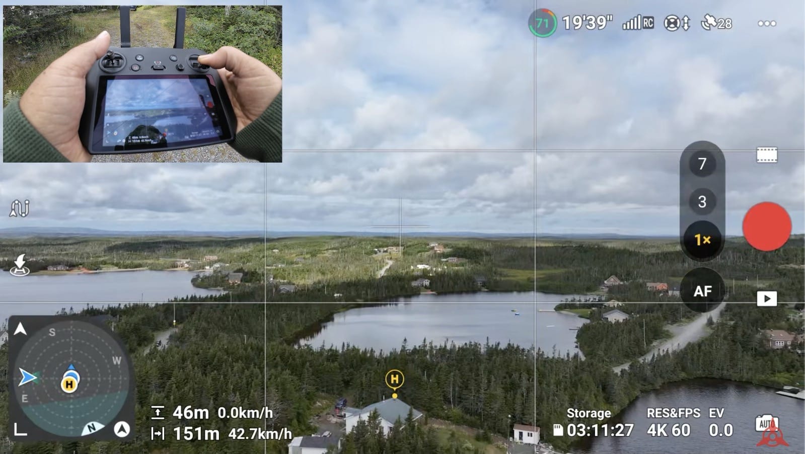 Flight app screen showing the augmented reality home point marker above a lake.