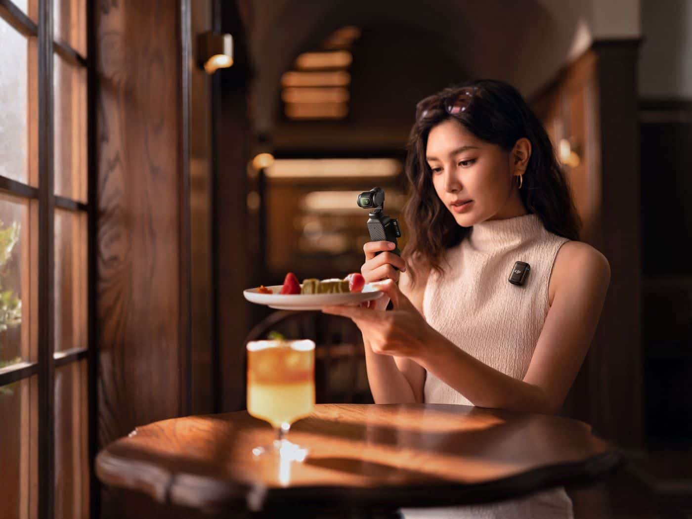 DJI Osmo Pocket 3 compact gimbal camera shown during handheld shooting.
