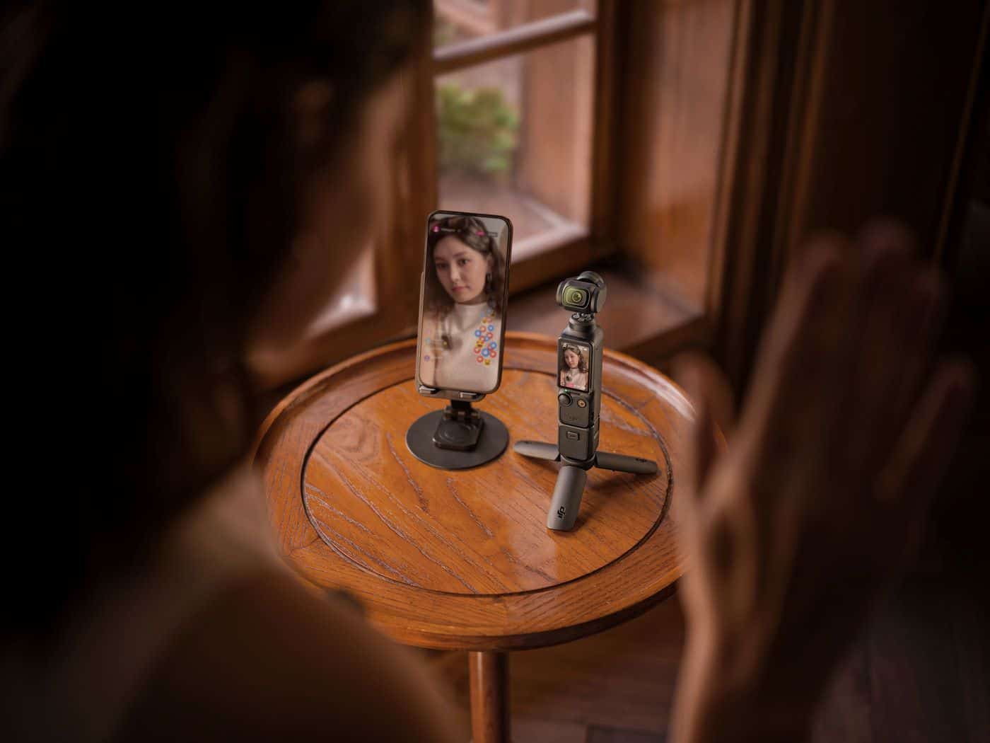 DJI Osmo Pocket 3 handheld gimbal camera with its 2-inch rotatable touchscreen.