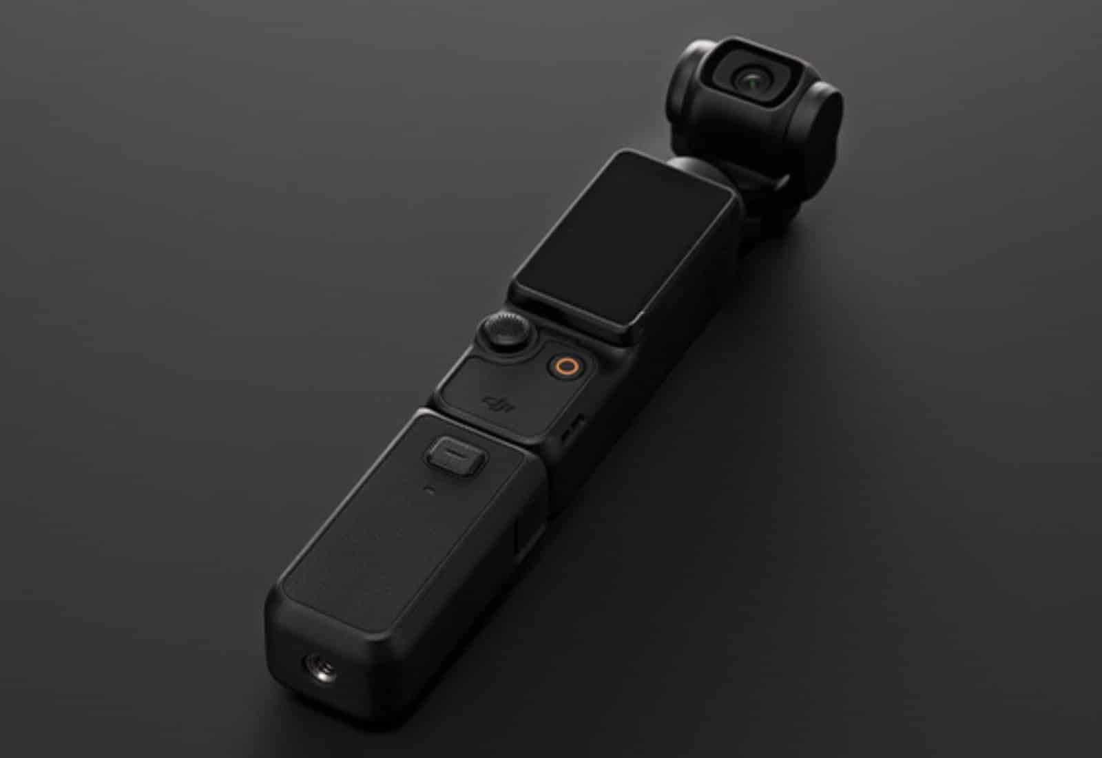 The DJI Osmo Pocket 3 camera with an extra battery grip attached to extend its battery life.