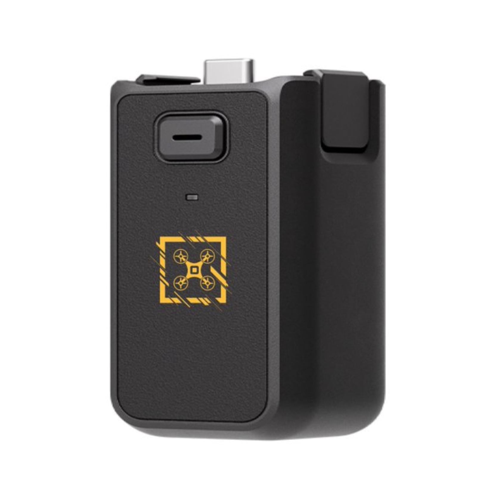 The DJI Osmo Pocket 3 camera with an extra battery grip attached to extend its battery life.