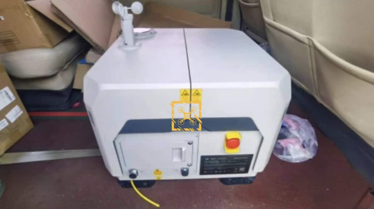 Leaked photo of a closed DJI Dock Mini with anemometer, loaded in a van.