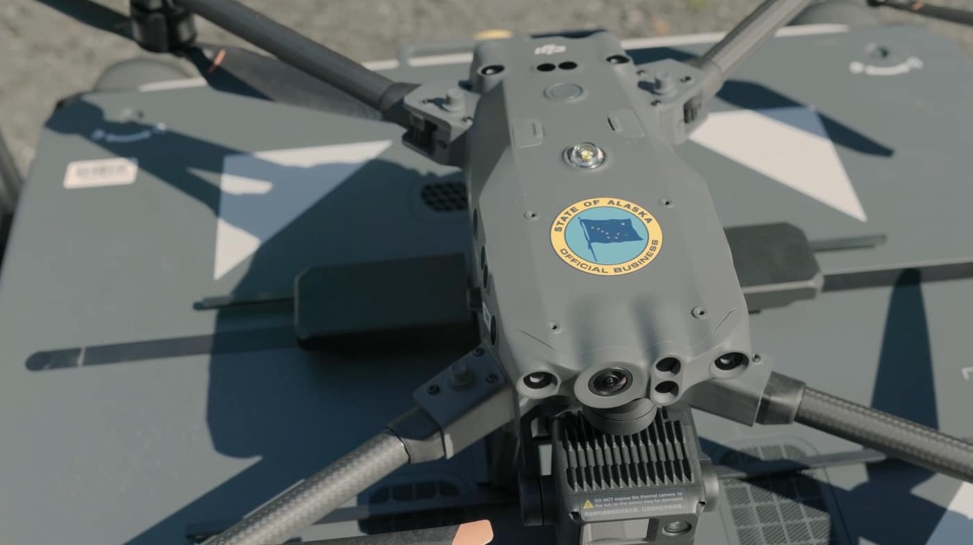 DJI Matrice with an Alaska state seal parked on a marked landing pad.