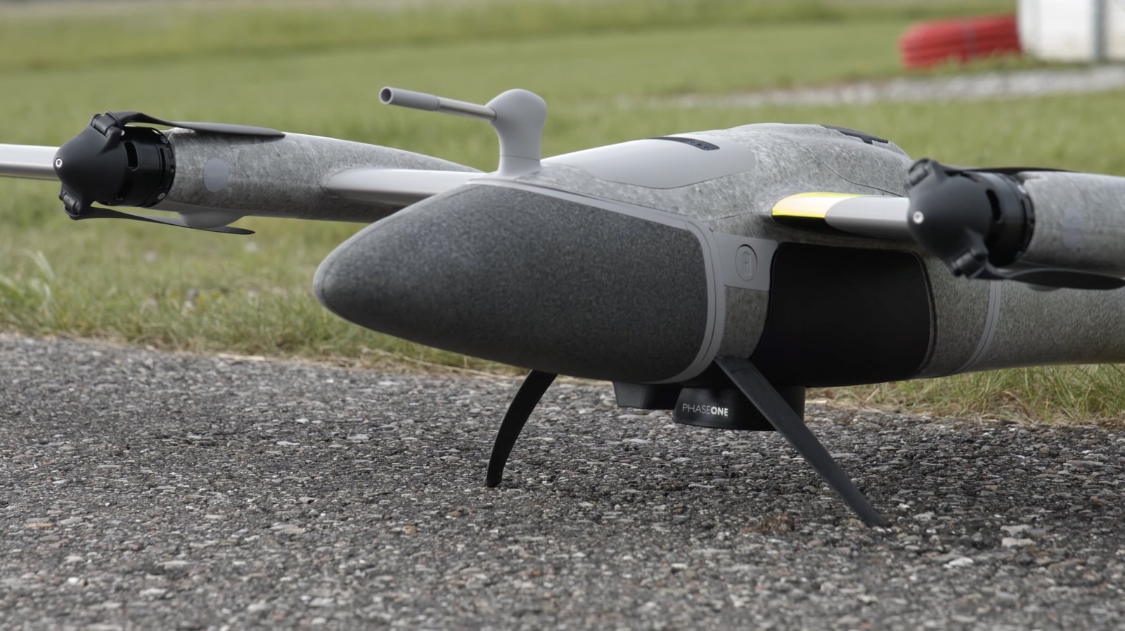 The P5 payload mounted beneath a fixed-wing UAV for corridor surveying work.