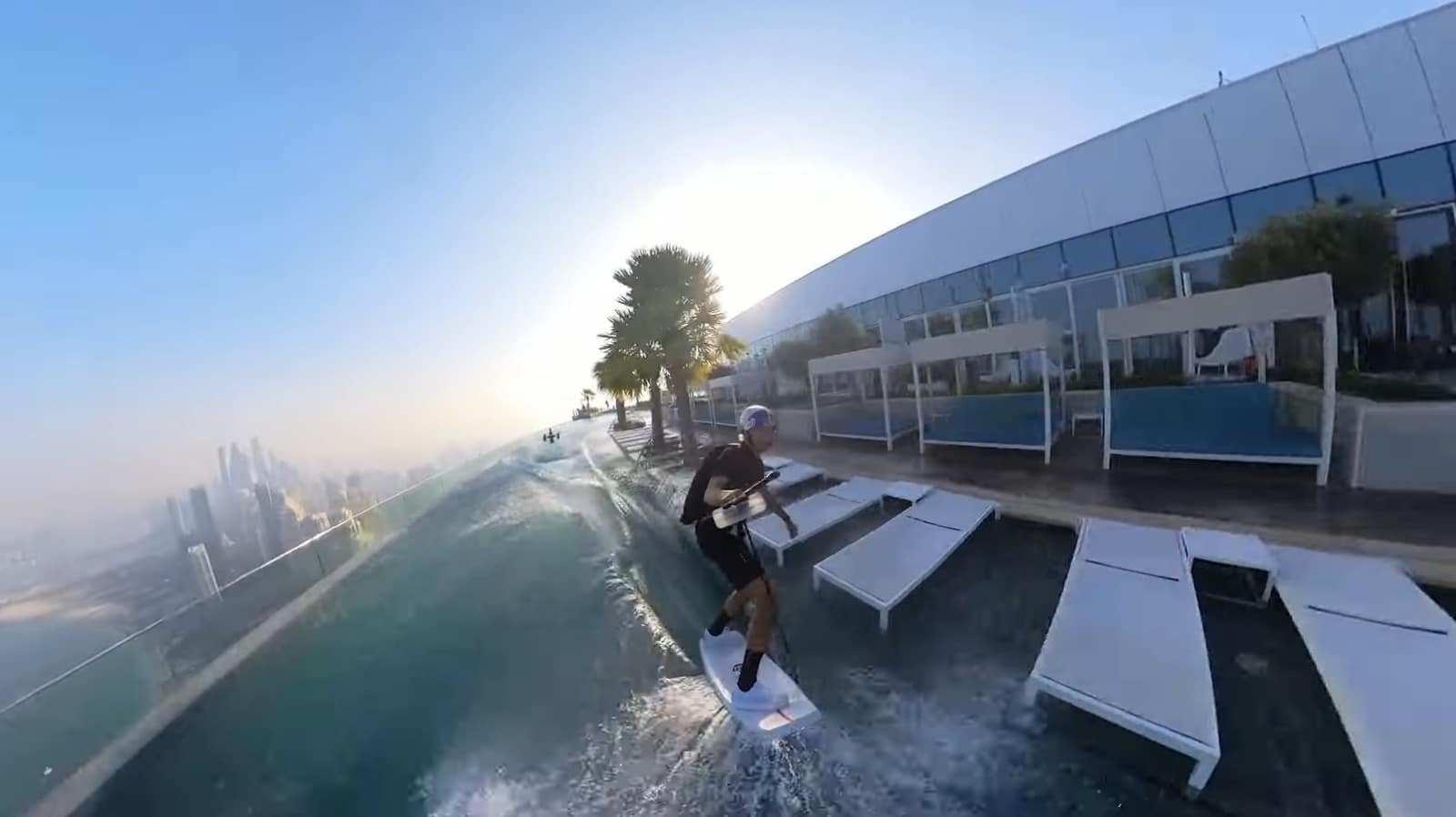 Drone-towed wakeskating across the rooftop pool at the Address Beach Resort.