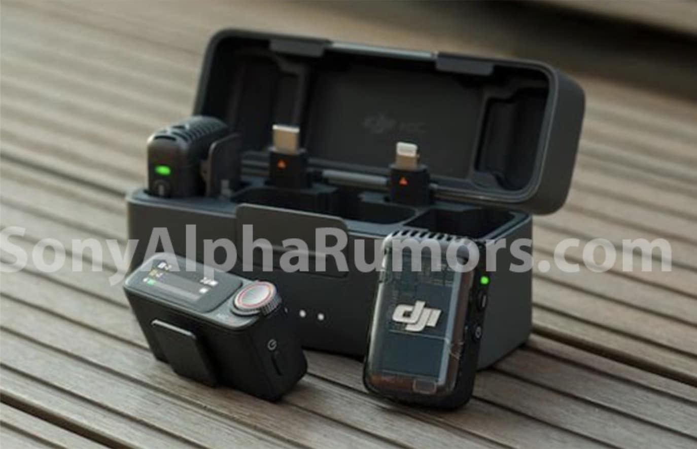 Leaked photo of the Mic 2 charging case open on a wooden deck with adapters.