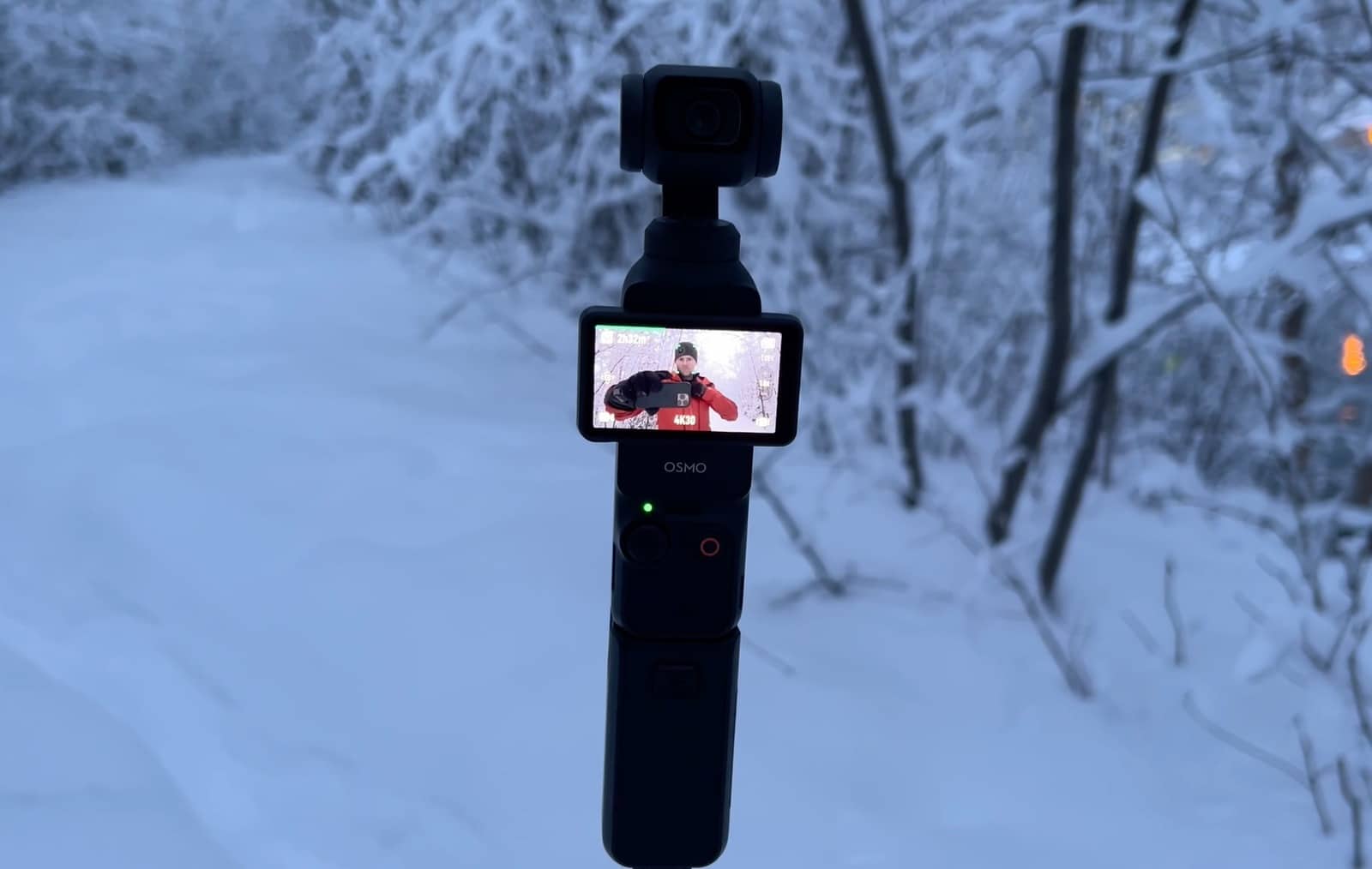 The Osmo Pocket 3 and Mini 4 Pro packed together with their travel accessories.