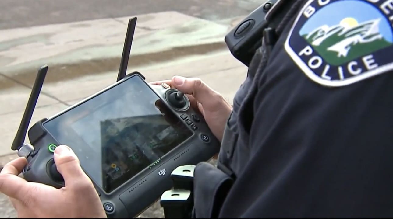 Boulder Police Part 107 pilot holding the controller for a DJI Matrice 30.