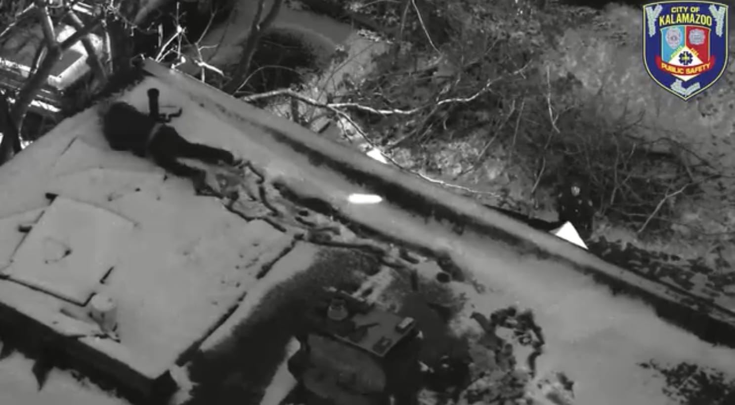 Kalamazoo Department of Public Safety drone imagery of the suspect on a four-story roof.