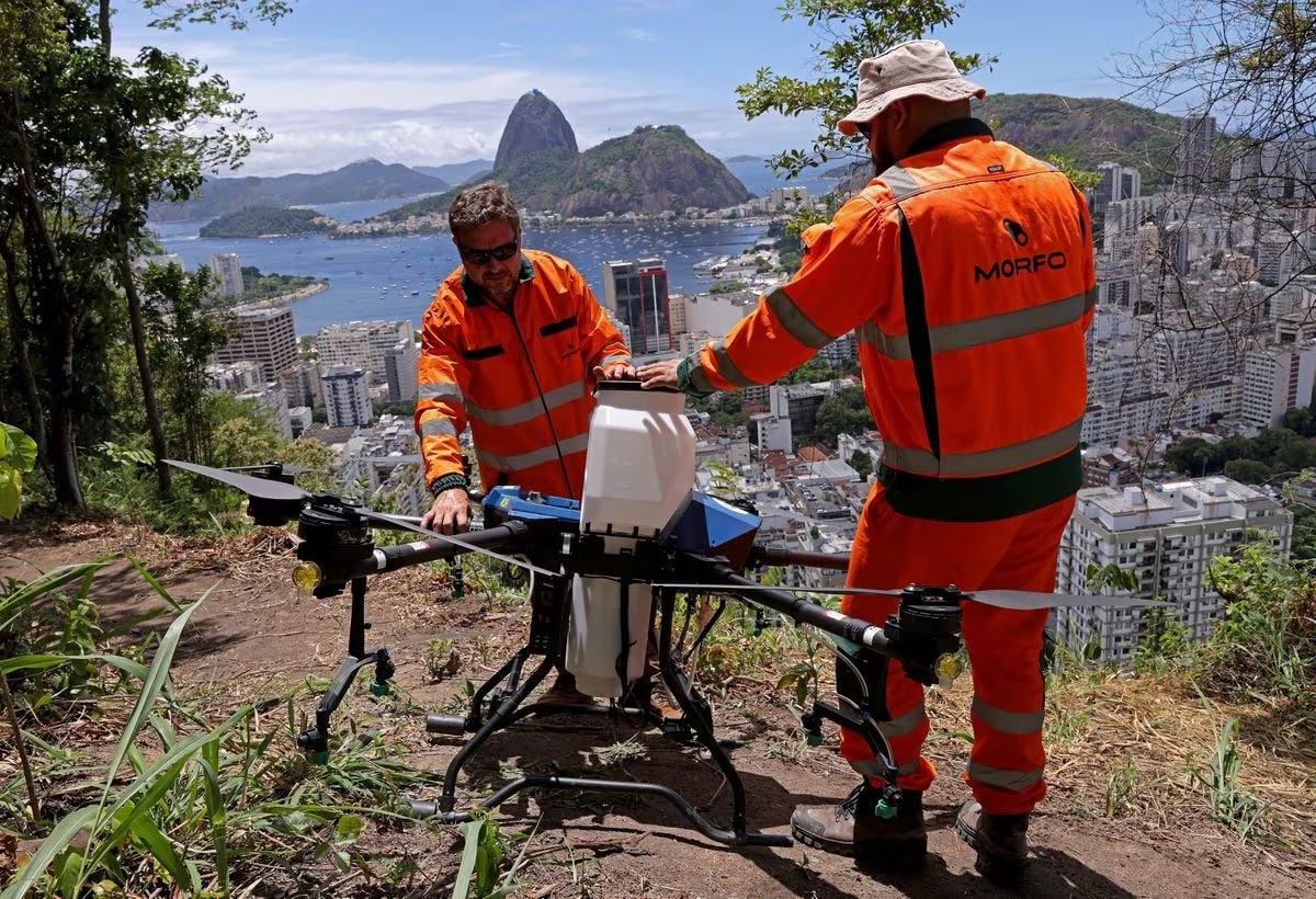 A Morfo drone dispersing seed capsules over the hills of Rio de Janeiro.