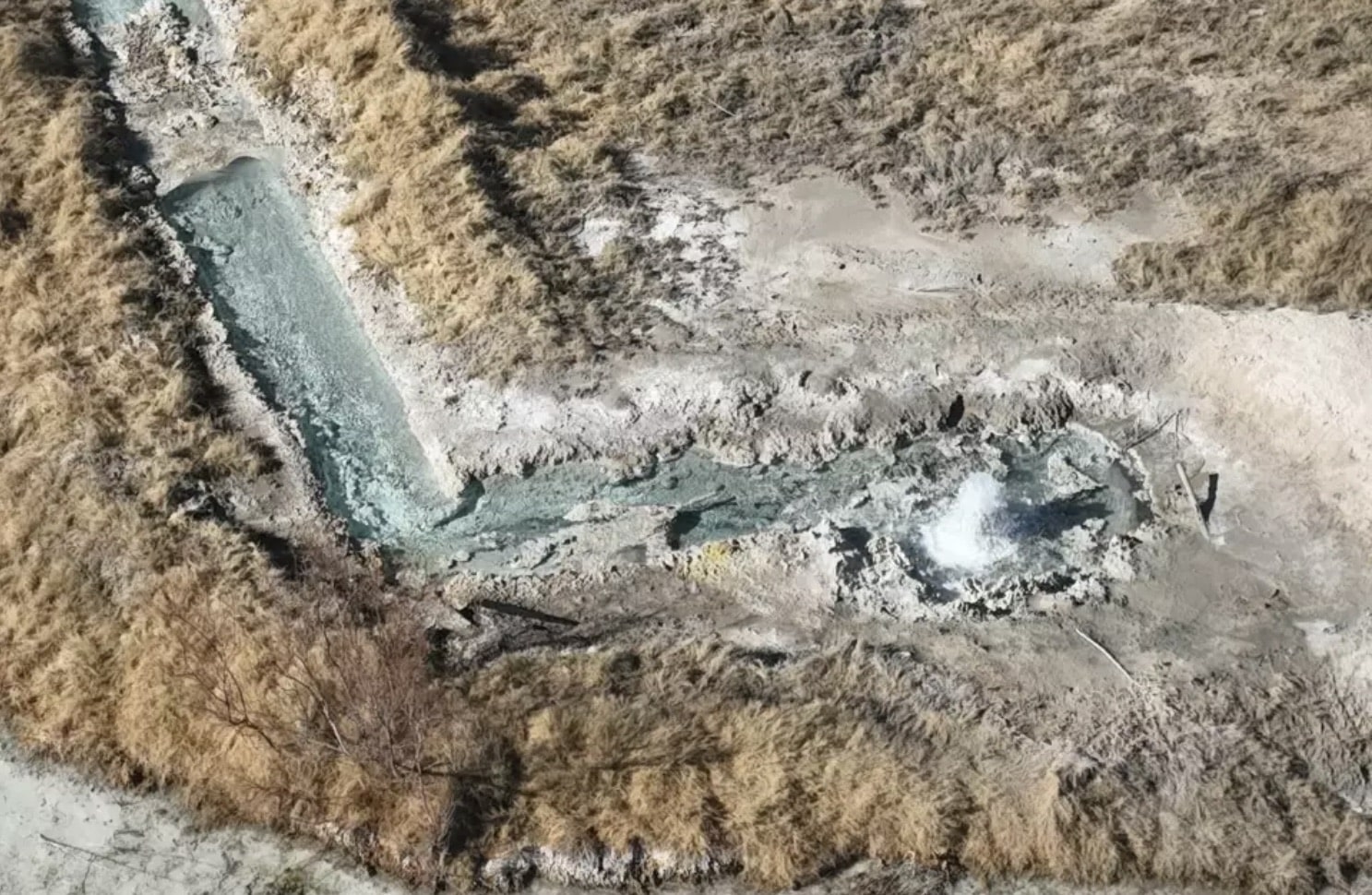 Water pooling in a waste pit at an unplugged Crane County oil well.