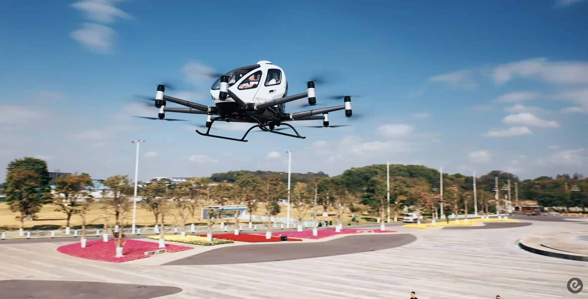 EHang EH216-S passenger drone hovering above a vertiport apron.