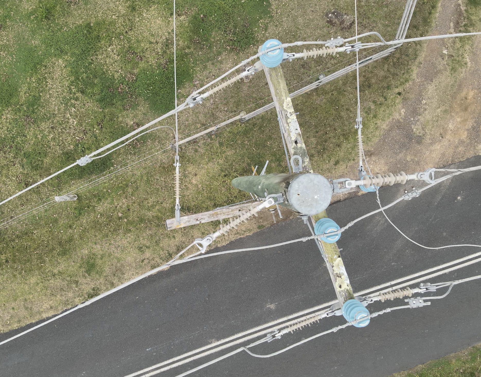Endeavour Energy staff acting as spotters while a drone inspects live powerlines.