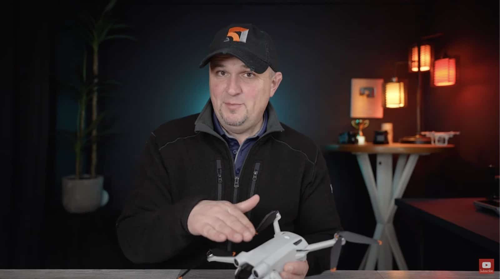 DJI Mini 3 Pro held up while weighing it against the Mini 4 Pro.
