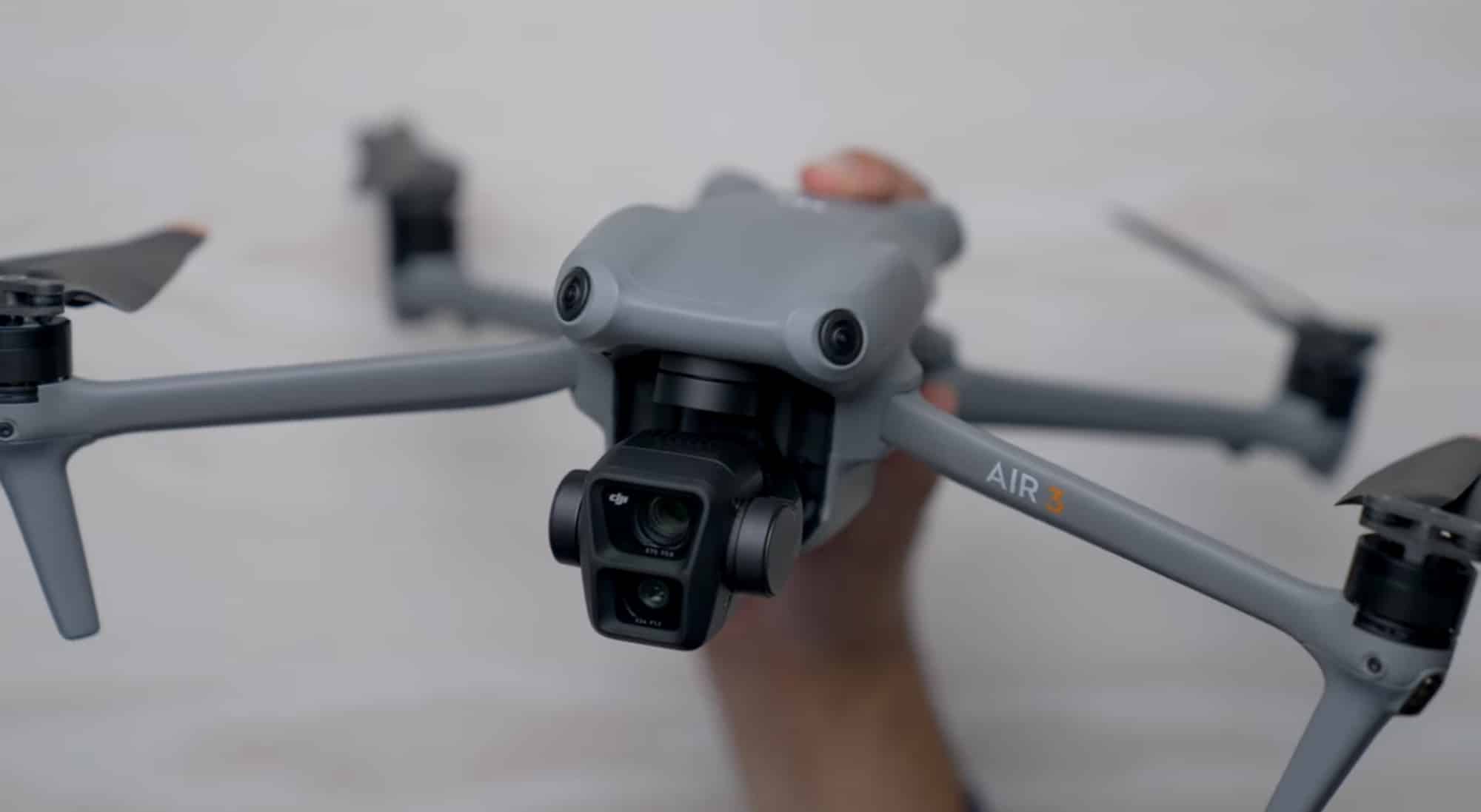 DJI Mini 4 Pro and DJI Air 3 side by side on a table.
