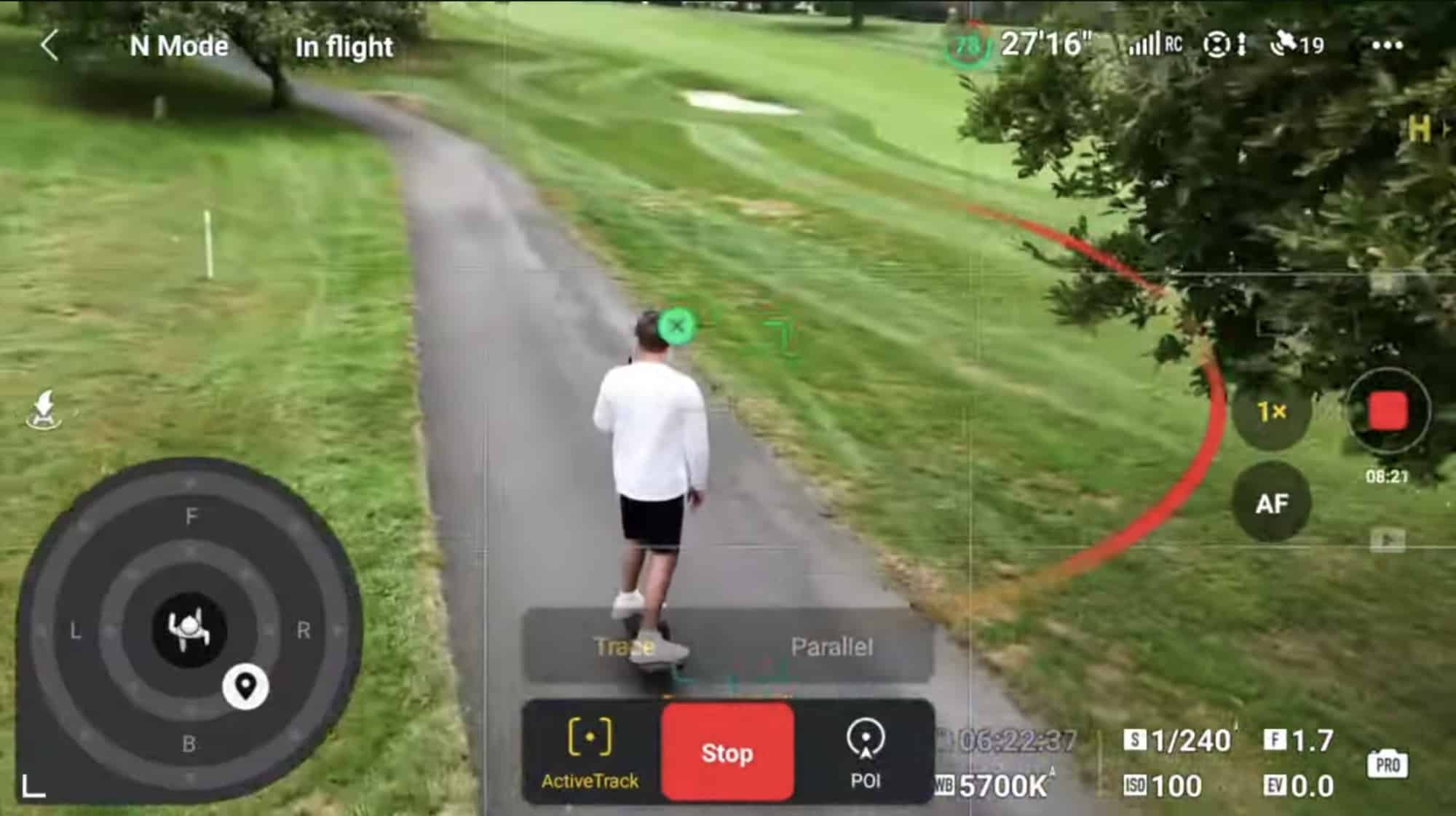 Drone tracking a rider along a tight tree-lined path during ActiveTrack.