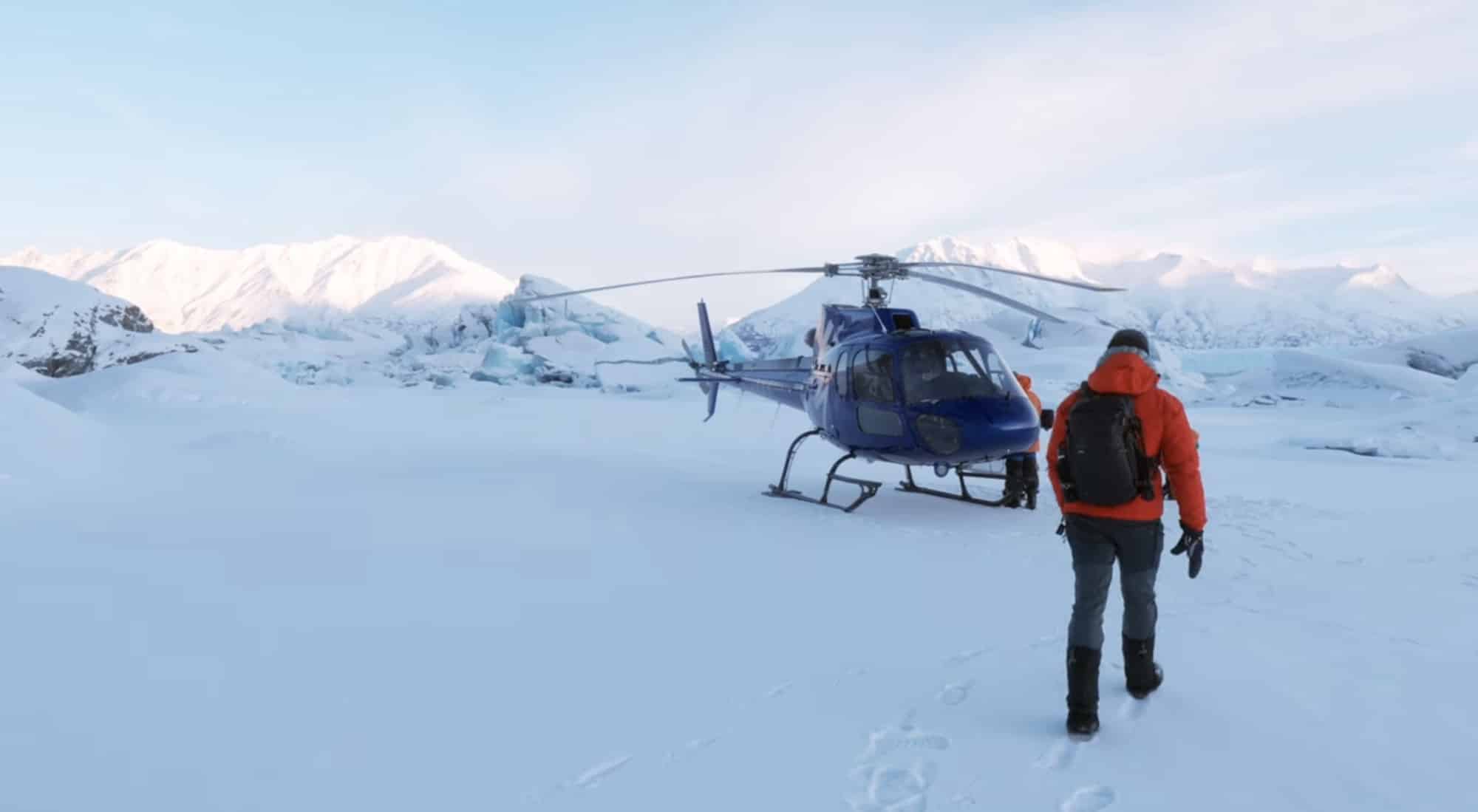 Jake Sloan in an orange jacket roughly 1,000 feet (305 meters) from the camera.