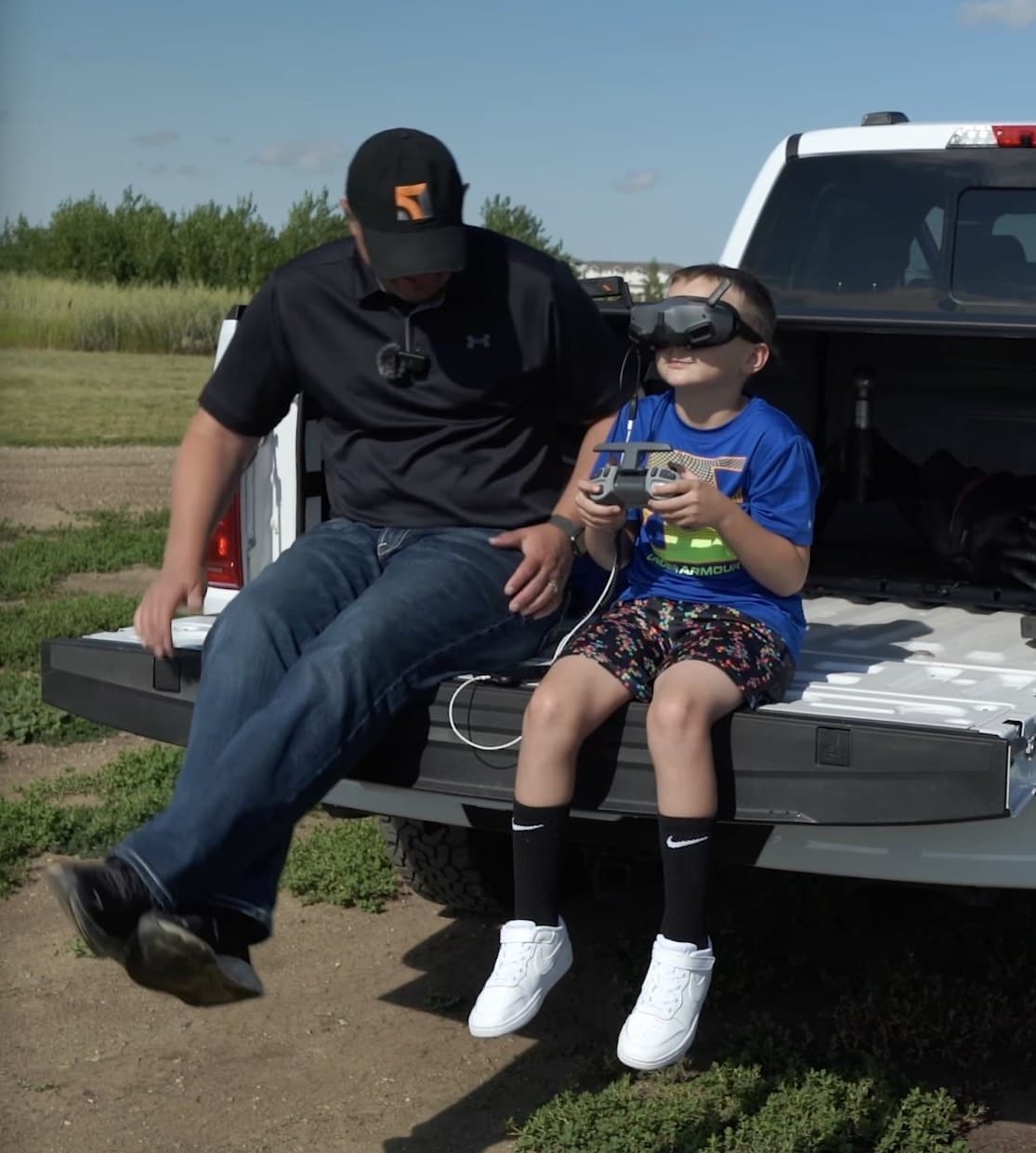 Sharing DJI goggles so a newcomer can experience the first-person aerial view.