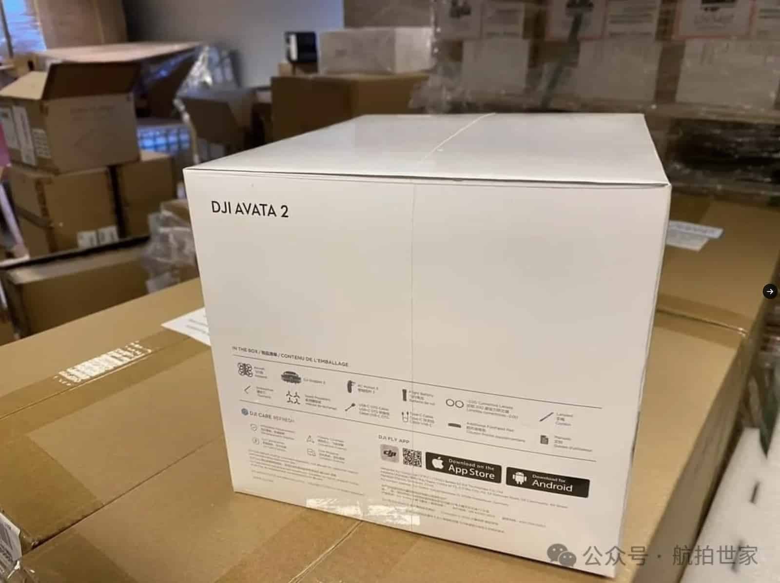 Sealed DJI Avata 2 retail box sitting on pallets in a warehouse.