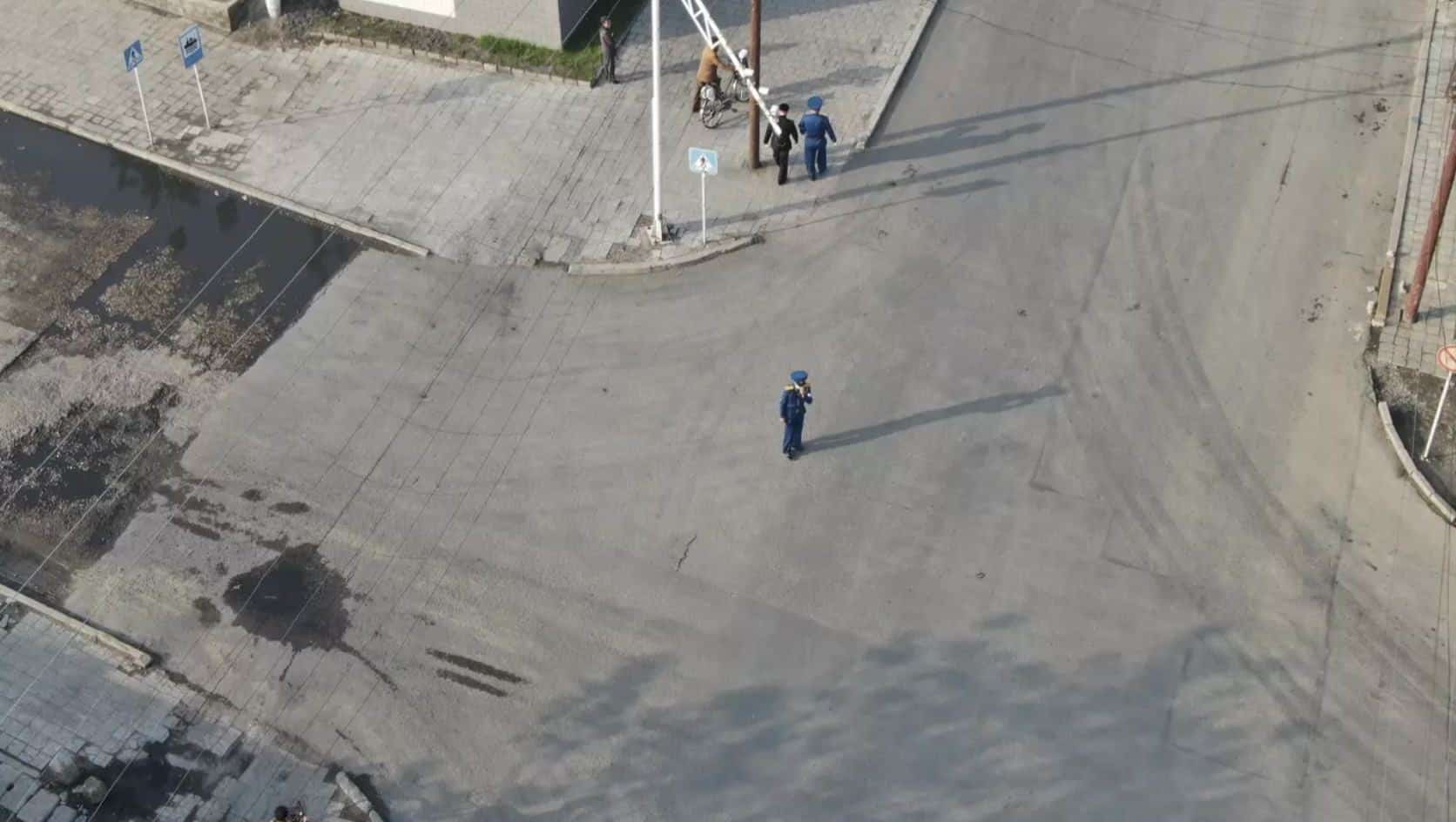Empty streets and low-rise buildings inside North Korea seen from the drone.