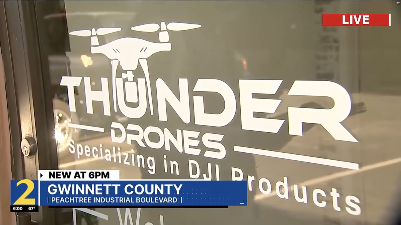 News footage of a drone shop window advertising DJI products.
