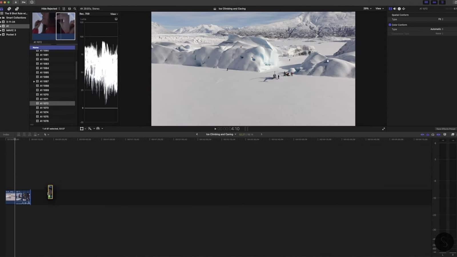 Slow-motion frame of the climber holding ice axes before the ascent.