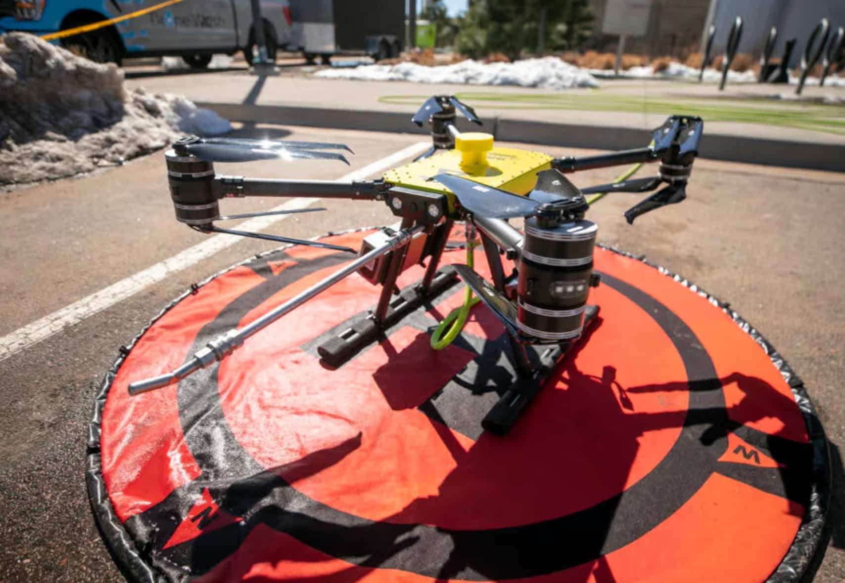 On March 18, 2024, a Drone Wash unit is positioned beneath the former Stapleton Airport tower, the current location of FlyteCo Brewing. Captured by Kevin J. Beaty for Denverite.