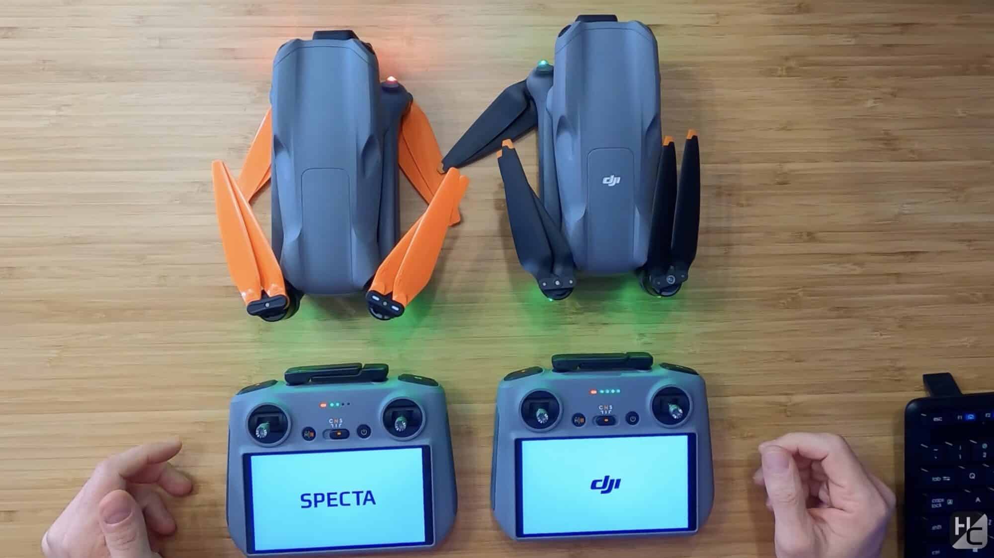 Cogito Specta Air fitted with orange propellers for identification beside a DJI Air 3.