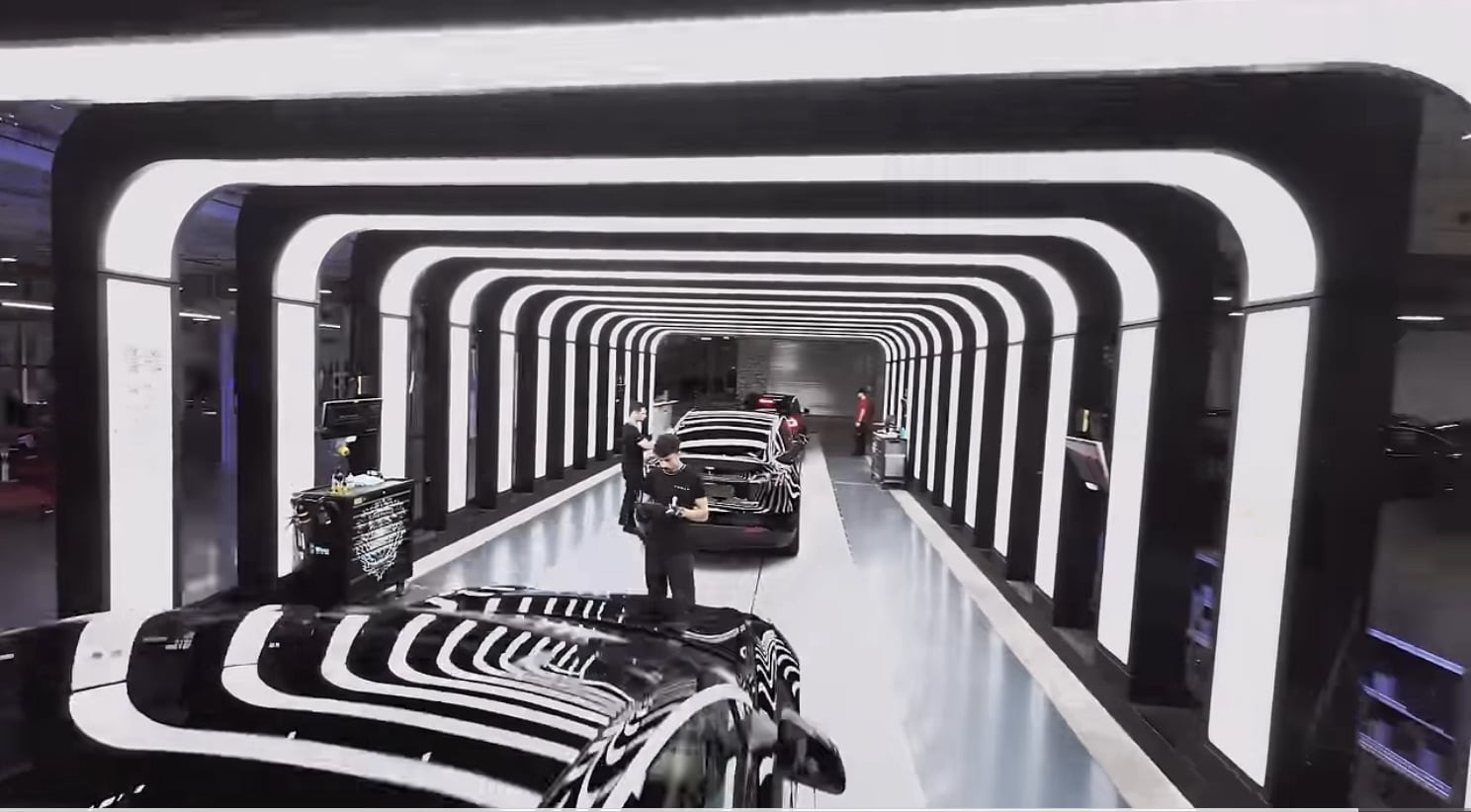 Frame from Tesla's Flying Through Giga Berlin drone video of the production line.