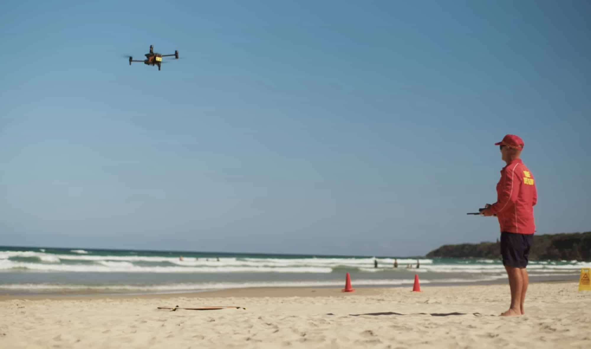 Surf Life Saving Queensland lifeguards operating a DJI Matrice 30T from the sand.