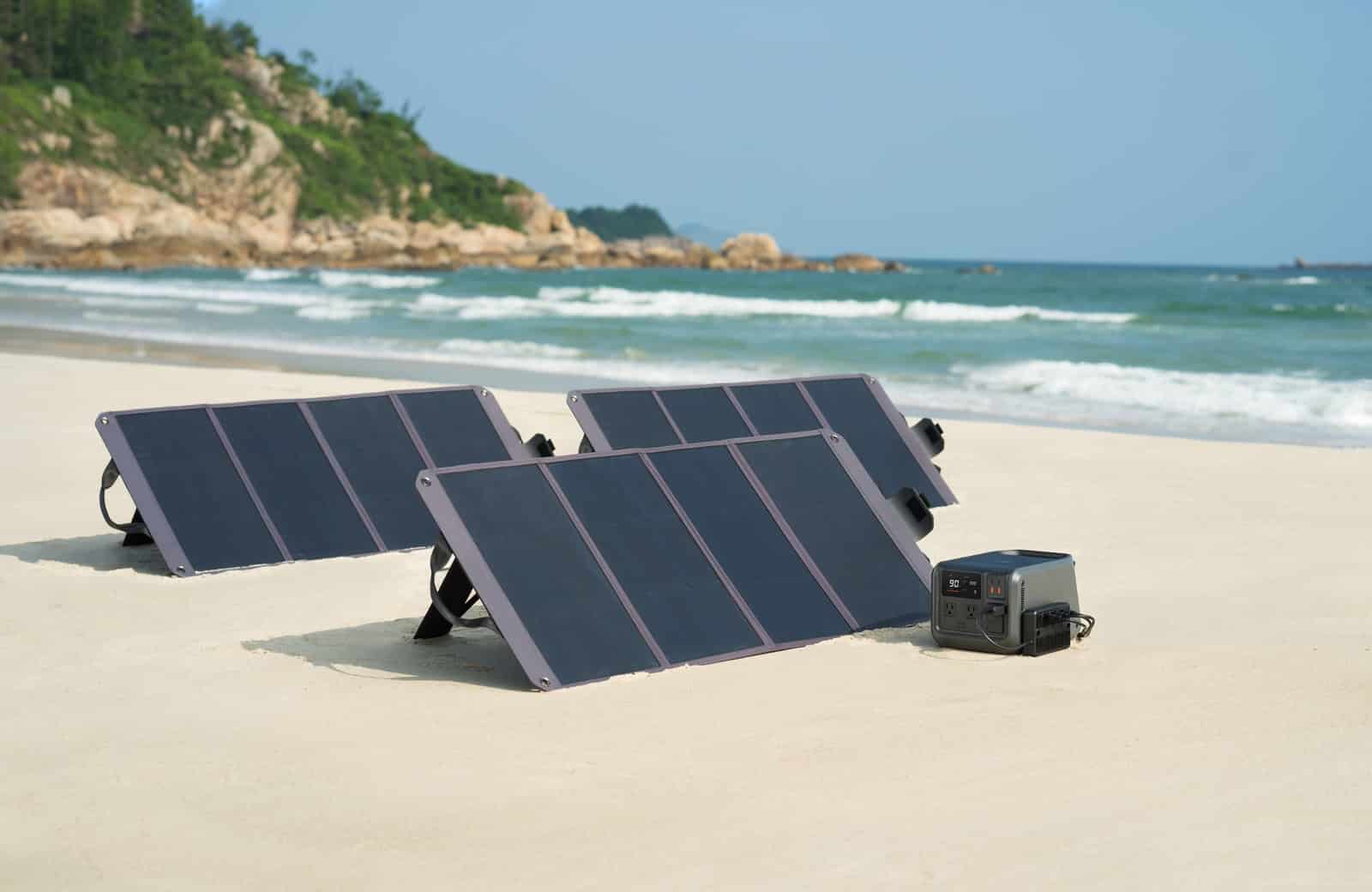 Three 100-watt solar panels wired to a DJI Power portable power station.
