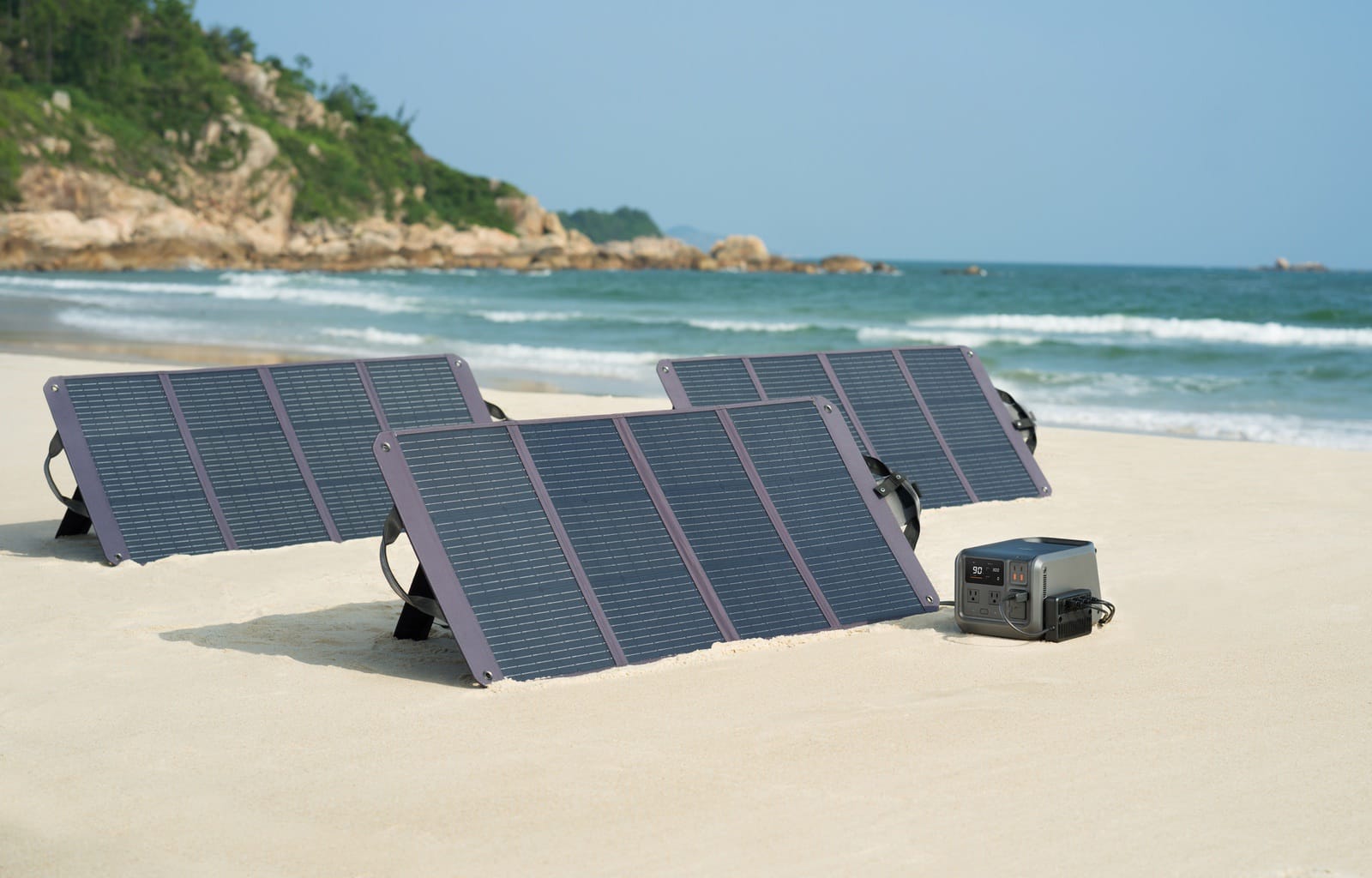 DJI Power station charging from three 120-watt solar panels in the field.