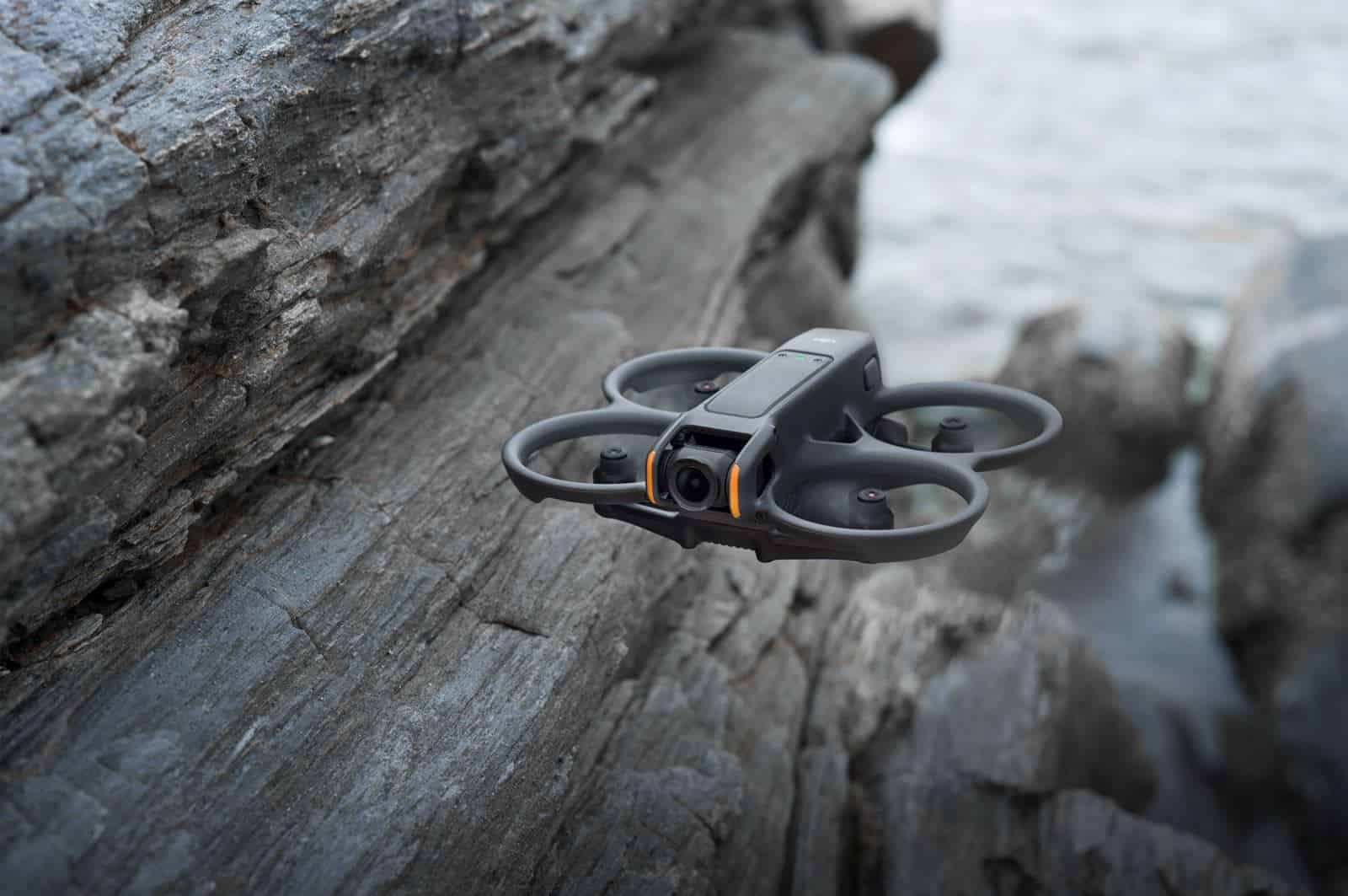 DJI Avata 2 flying close to the ground in a tight space.