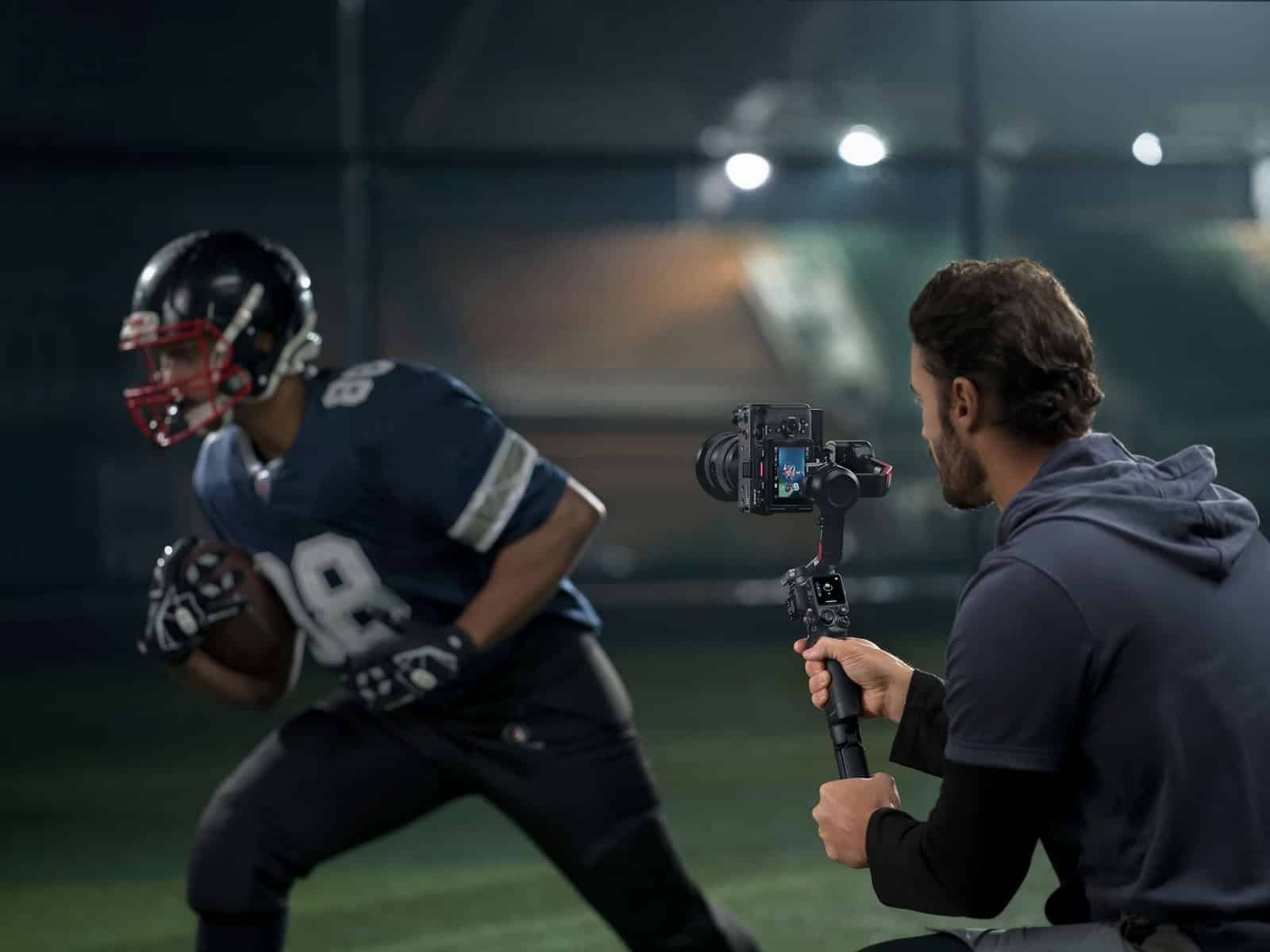 DJI RS 4 gimbal carrying a mirrorless camera in the launch imagery.