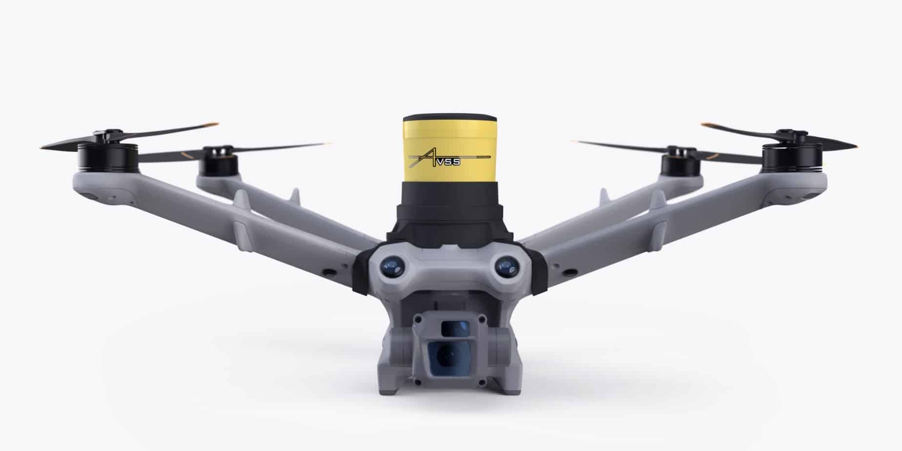 Drone fitted with a yellow AVSS parachute recovery canister above its body.