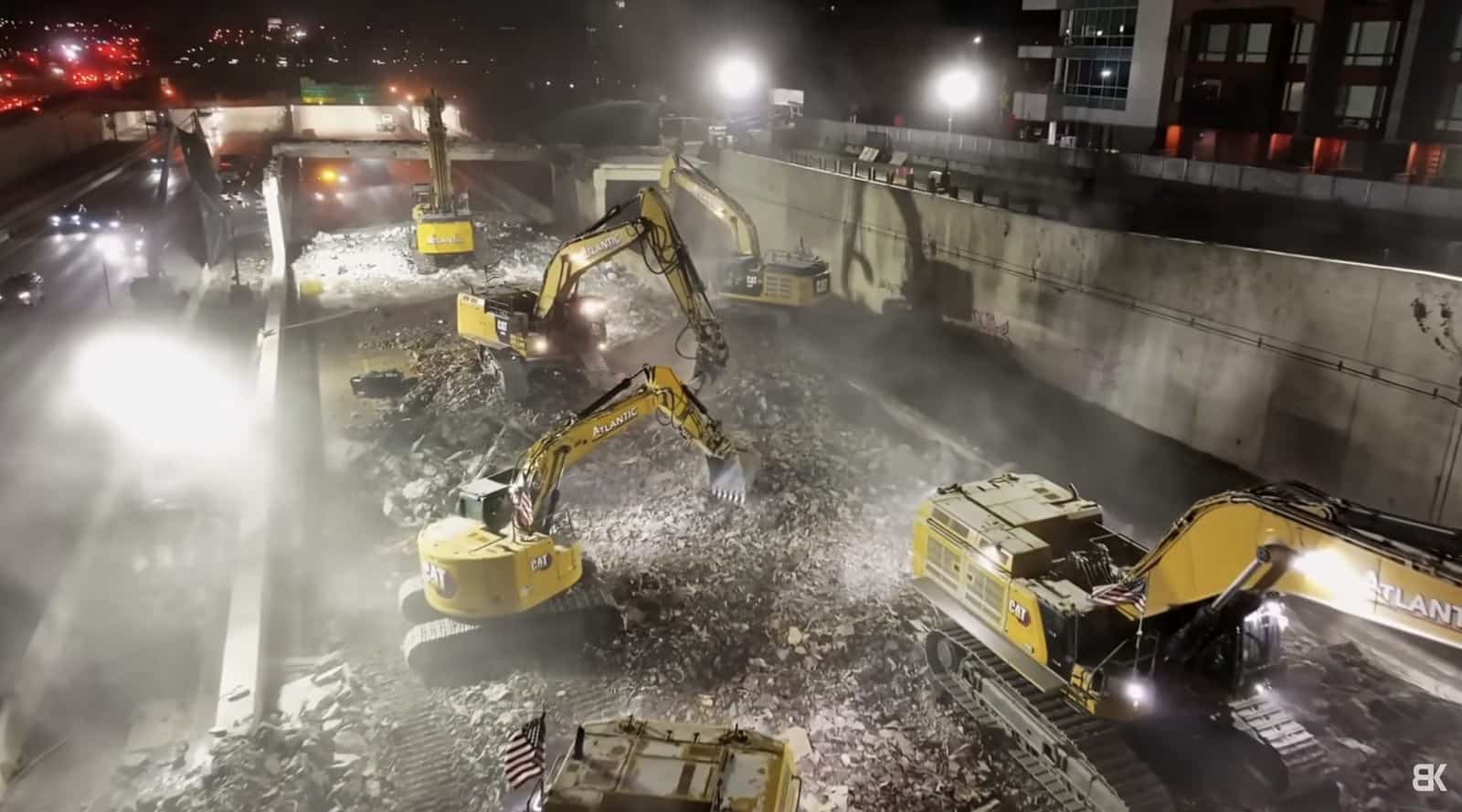 Heavy machinery at work during the I-95 cap demolition phase.