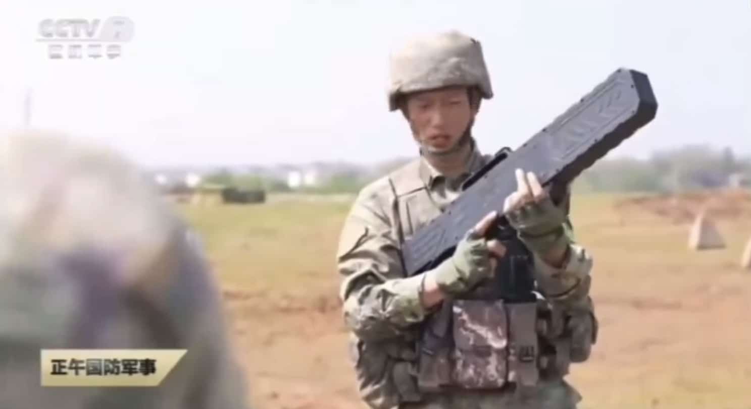 Chinese soldier aiming a counter-drone gun during countermeasures training.