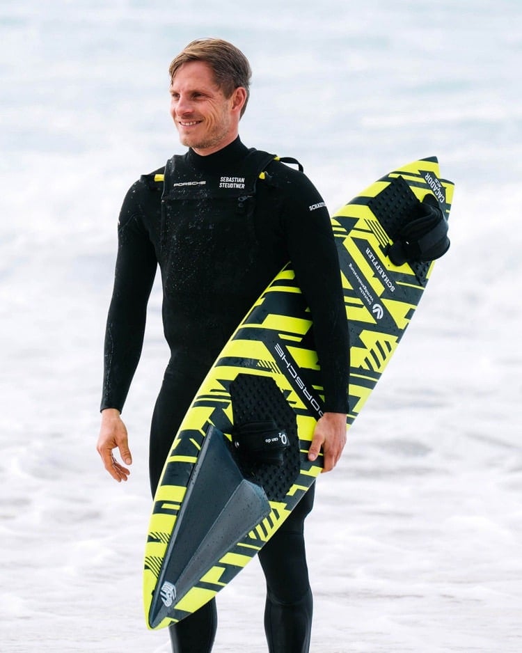 Sebastian Steudtner's custom-designed surfboard, the "Caçador RS," developed in collaboration with Porsche, is capable of achieving speeds up to 100 kilometers per hour, enabling him to tackle the world's largest waves. | Photo credit Porsche