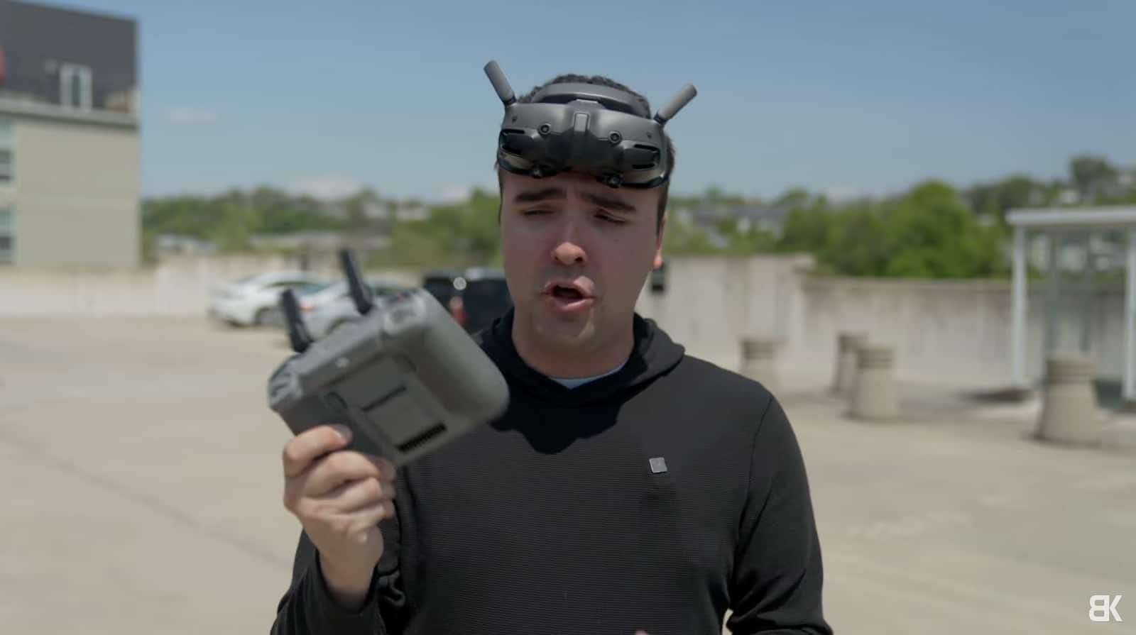 Billy Kyle wearing DJI Goggles 3 while holding the DJI RC 2.