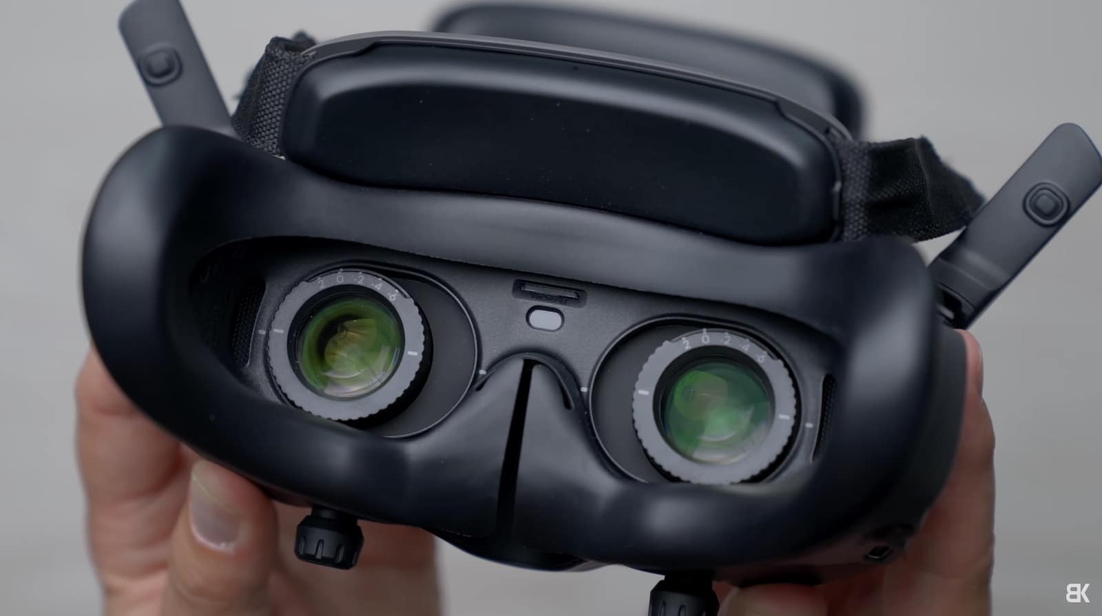 The diopter adjustment, head sensor and microSD slot on the underside of the goggles.