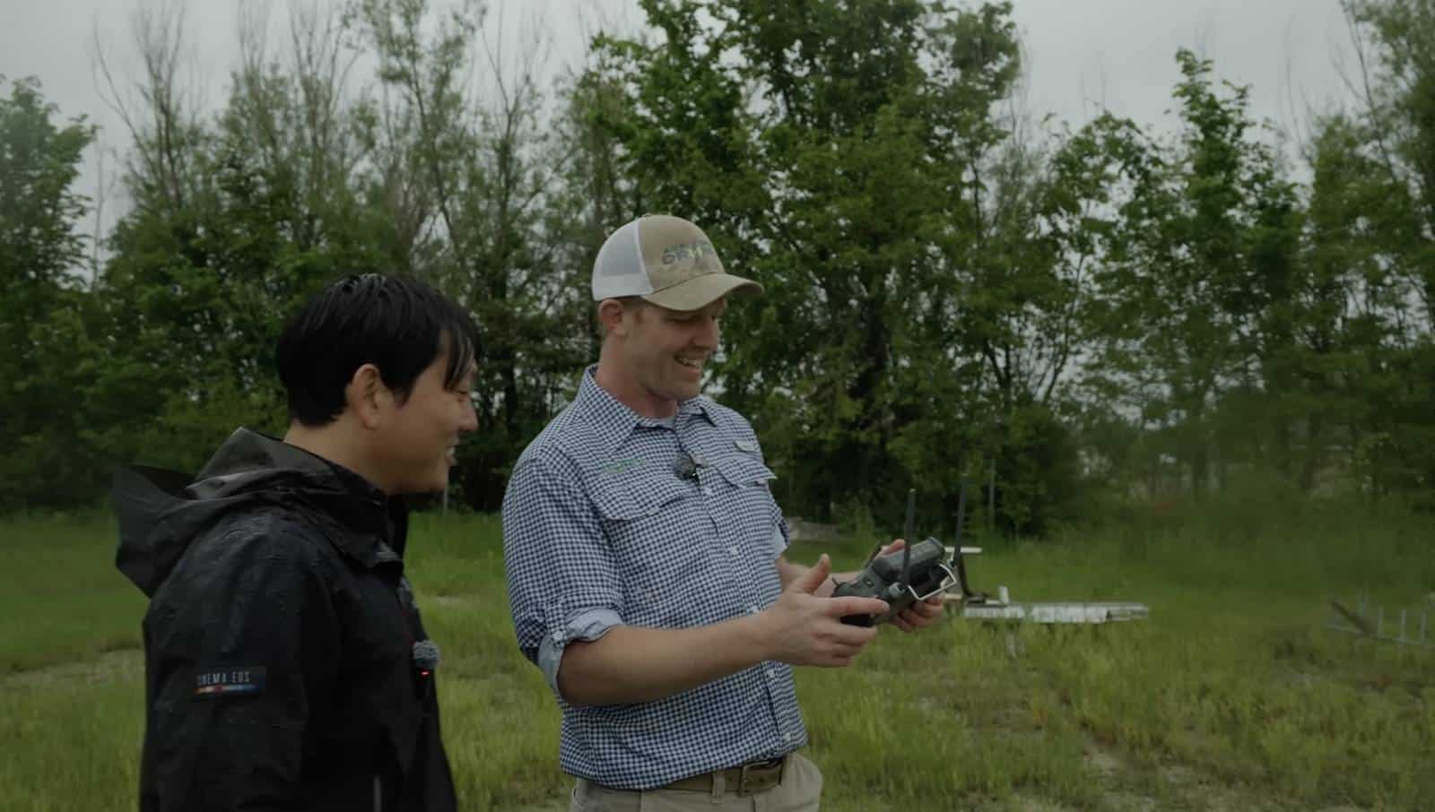 Gene Nagata watching an Agri Spray Drones pilot work the FlyCart 30 controller.