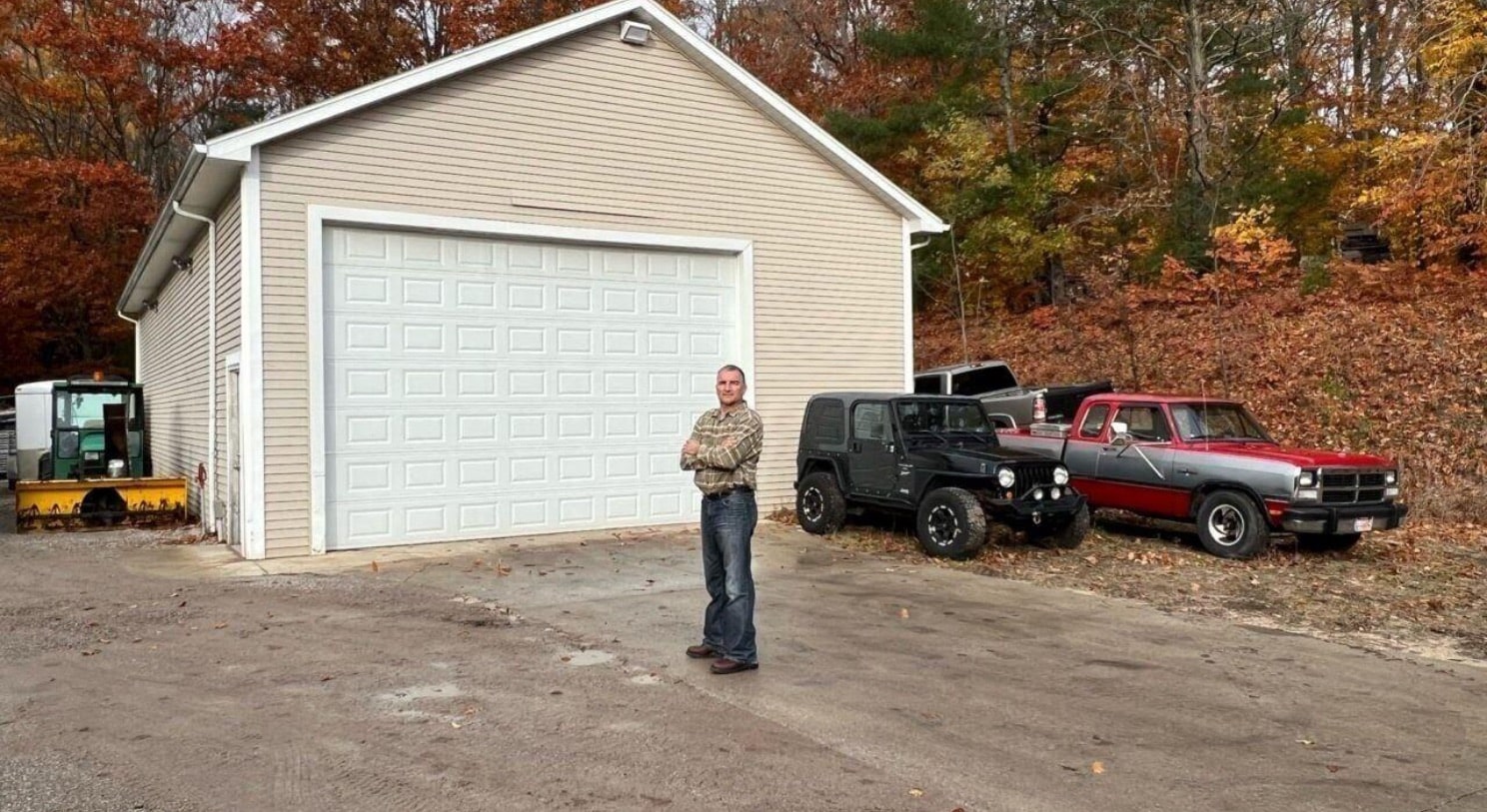 Todd Maxon poses beside vehicles on his property. Photo provided by the Institute for Justice.