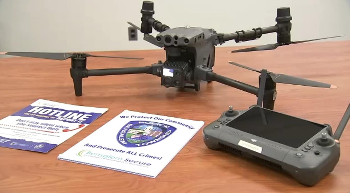 A DJI enterprise drone and its controller on a table with Bensalem police flyers.